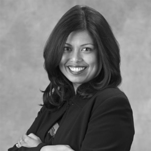 Young woman smiling with arms crossed
