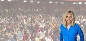 Kim Jones, executive career coach, standing in front of crowded audience at career conference