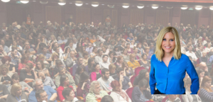 Kim Jones, executive career coach, standing in front of crowded audience at career conference