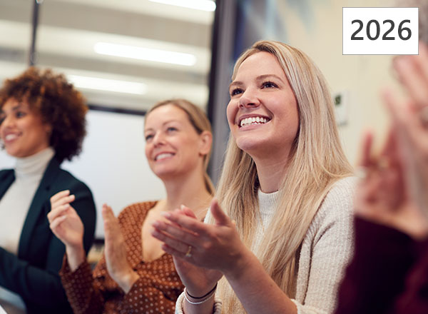 Group of women applauding at Signature Select Session event